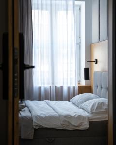 Posteľ alebo postele v izbe v ubytovaní Glow Apartments - Apartamenty Studio KOZIA Gdańsk Śródmieście
