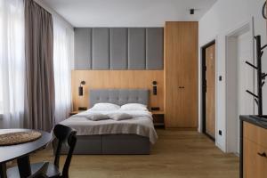 Posteľ alebo postele v izbe v ubytovaní Glow Apartments - Apartamenty Studio KOZIA Gdańsk Śródmieście