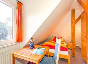 En eller flere senge i et værelse på Villa Lübcke, Fewo 7