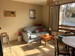 A seating area at Le Repaire des Cimes - Proche des pistes