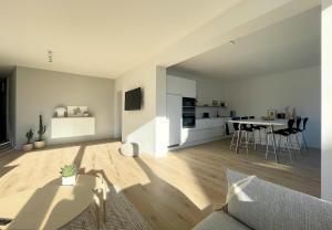 a living room with a couch and a table at La terrasse des sources in Spa +18 photos
