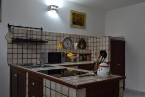 Kuchyň nebo kuchyňský kout v ubytování TAVERNETTA DEL BORGO