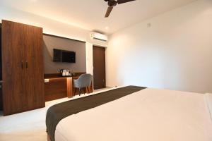 Ένα ή περισσότερα κρεβάτια σε δωμάτιο στο Hotel The Code Exclusive