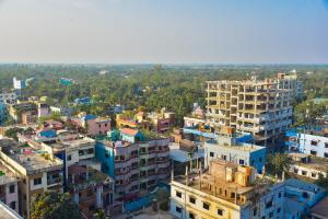an aerial view of a city with buildings at Al Hera Resort in Sreemangal