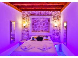 Ένα ή περισσότερα κρεβάτια σε δωμάτιο στο Nergiz Villas +91 φωτογραφίες