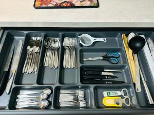 a tray filled with utensils in a drawer at FEWO- Rafaelo2 in Marsberg