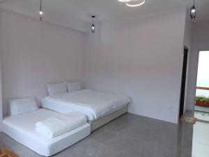 Postel nebo postele na pokoji v ubytování 小白兔愛跳舞包棟