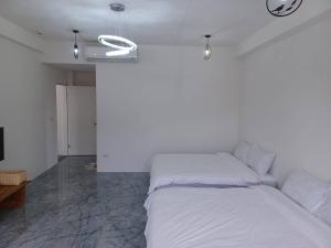 Postel nebo postele na pokoji v ubytování 小白兔愛跳舞包棟