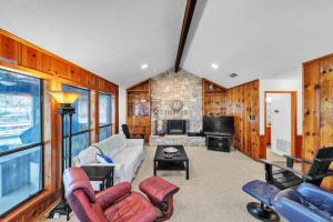 a living room filled with furniture and a fireplace at Lake House at Granbury home in Granbury +25 photos