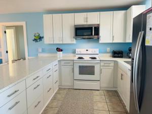 Kuchyň nebo kuchyňský kout v ubytování When Pigs Fly Home