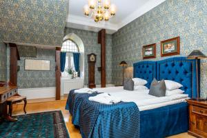 Postel nebo postele na pokoji v ubytování Thorskogs Slott
