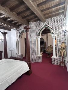 Ένα ή περισσότερα κρεβάτια σε δωμάτιο στο H La Posada