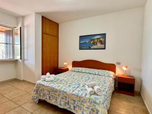 En eller flere senge i et værelse på Residence L' Antico Frantoio + 165 billeder