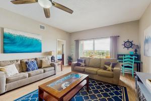 a living room with a couch and a table at Madeira Bay Resort 509 in St Pete Beach