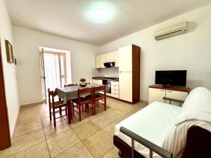 Et tv og/eller underholdning på Residence L' Antico Frantoio