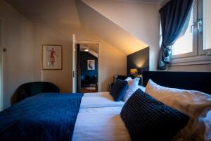 Postel nebo postele na pokoji v ubytování Hotell Aqva Restaurang & Bar Ett Biosfärhotell med fokus på hållbarhet