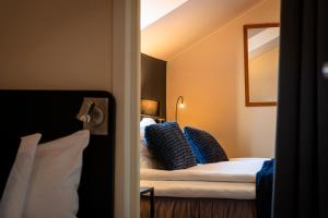 Postel nebo postele na pokoji v ubytování Hotell Aqva Restaurang & Bar Ett Biosfärhotell med fokus på hållbarhet