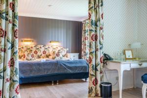 Postel nebo postele na pokoji v ubytování Thorskogs Slott