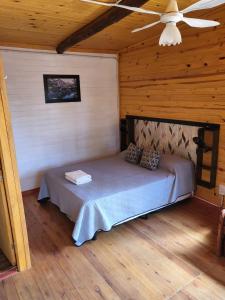 Postel nebo postele na pokoji v ubytování D'Charrúas Cabañas Chajarí