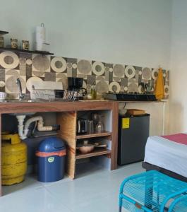 a kitchen with a sink and a counter with dishes at 5 Beach Suite wpool sea access in La Libertad