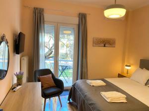 Ένα ή περισσότερα κρεβάτια σε δωμάτιο στο allegro alsos apartment