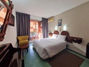 Postel nebo postele na pokoji v ubytování Hotel Tachfine