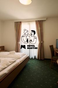 Posteľ alebo postele v izbe v ubytovaní Hotel Martini Kaprun - including summercard