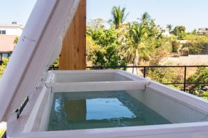 a plunge pool on the balcony of a house at Casa Toro La Punta in Puerto Escondido +43 photos