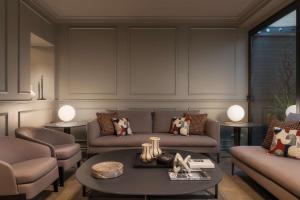 a living room with two couches and a table at WorldHotel Casati 18 in Milan