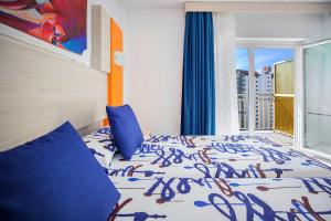 Postel nebo postele na pokoji v ubytování Hotel Servigroup Orange