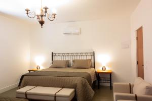 Ένα ή περισσότερα κρεβάτια σε δωμάτιο στο Hotel Fazenda São Silvano +21 φωτογραφίες