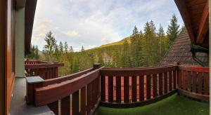 a large deck with a view of a mountain at Apartmánový dom Fatrapark 1 s Wellness - Hlavná recepcia in Ružomberok