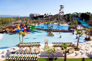 a water park with a roller coaster and slides at Apartamentos CH3 parking incluido in Salou