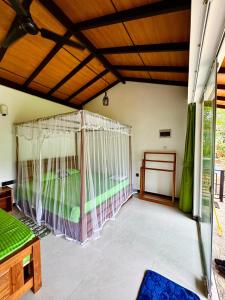 Letto o letti in una camera di Rainforest River Bay