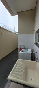 a white sink in a room with a balcony at White River in Boa Vista +23 photos