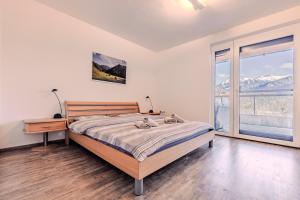Voodi või voodid majutusasutuse Penthouse in den Bergen toas