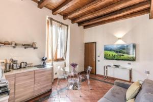 a living room with a couch and a table at Casa Navona Apartments in Rome