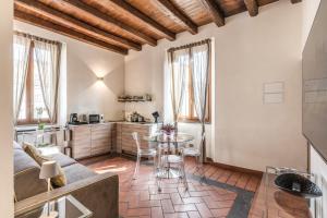 a living room with a couch and a table at Casa Navona Apartments in Rome