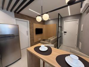 Køkken eller tekøkken på Apartamento com suíte e varanda no centro