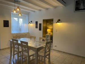 a dining room with a table and chairs at Chez Paul in Jeuxey