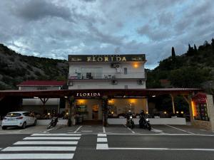 a group of motorcycles parked in front of a hotel at Apartment Tribanj Florida in Viniština