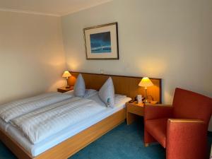 Postel nebo postele na pokoji v ubytování Aparthotel Kachelot