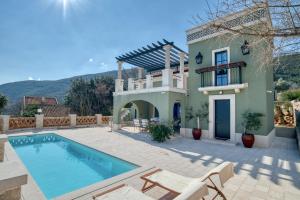 a villa with a swimming pool and a house at Casa Verde 27 in Herceg-Novi