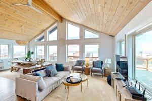 a living room with a couch and a table at The Kiwanda Surf House in Pacific City