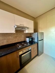 Kuchyň nebo kuchyňský kout v ubytování Luxe et Confort à Prestigia Marrakech
