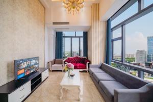 Φωτογραφία από το άλμπουμ του April Fair Duplex Apartment Guangzhou South Railway Station Ao Yuan Yue Shi Dai Branch στο Γκουανγκζού