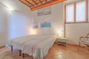 Postel nebo postele na pokoji v ubytování Casa Vittoria sul Lungomare - Goelba