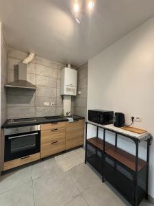 a kitchen with a stove and a counter top at Apartment Close to Zuid Park in Antwerp