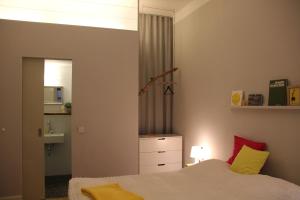 Postel nebo postele na pokoji v ubytování aTa & oMo 2