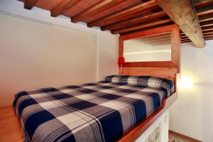 Giường trong phòng chung tại Santa Croce Suite loft